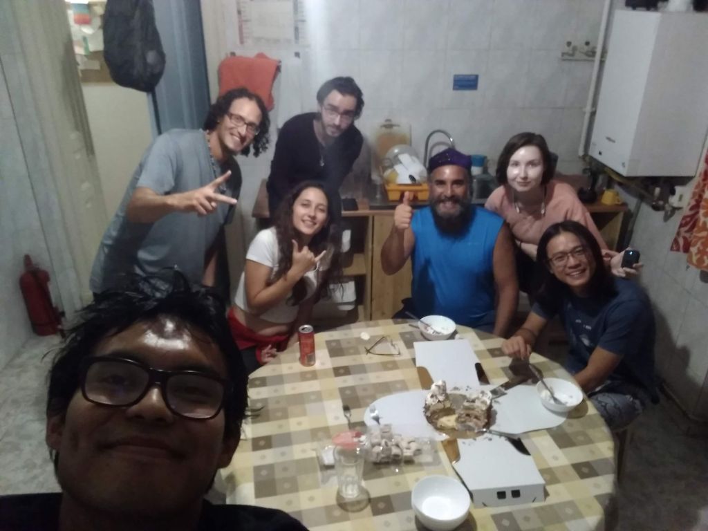 Volunteers in a dinner in a hostel of Bucharest, Romania