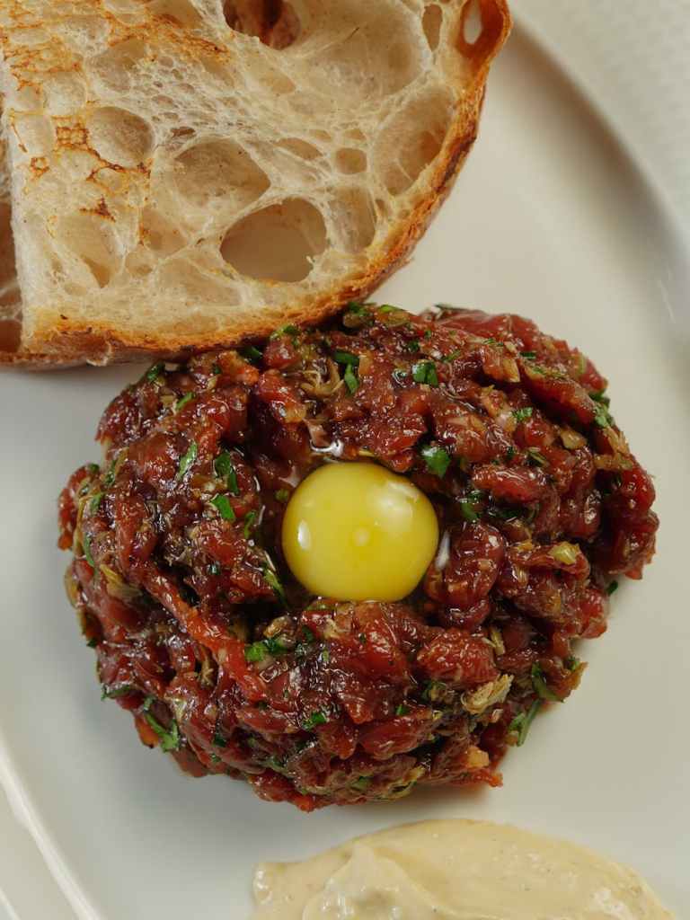 A recipe of egg and tomatoes, with bread