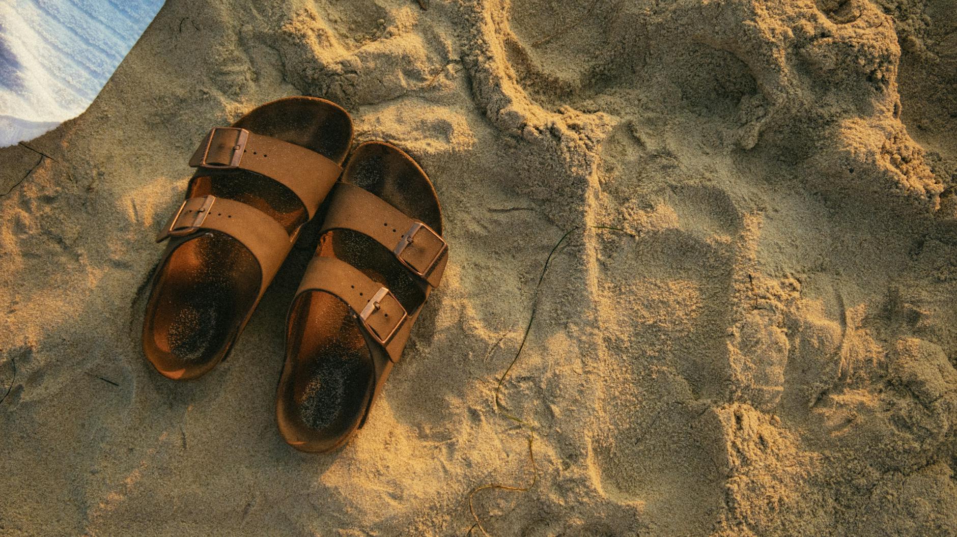 Some sandals on the beach during a travel