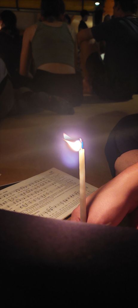 A candle in a mass in Taizé, France,